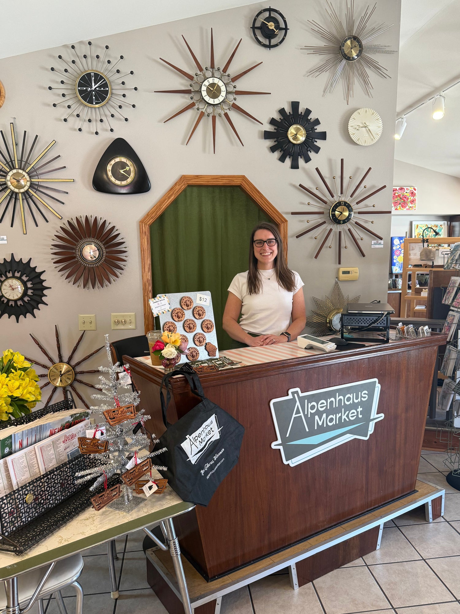 Owner standing behind the front counter